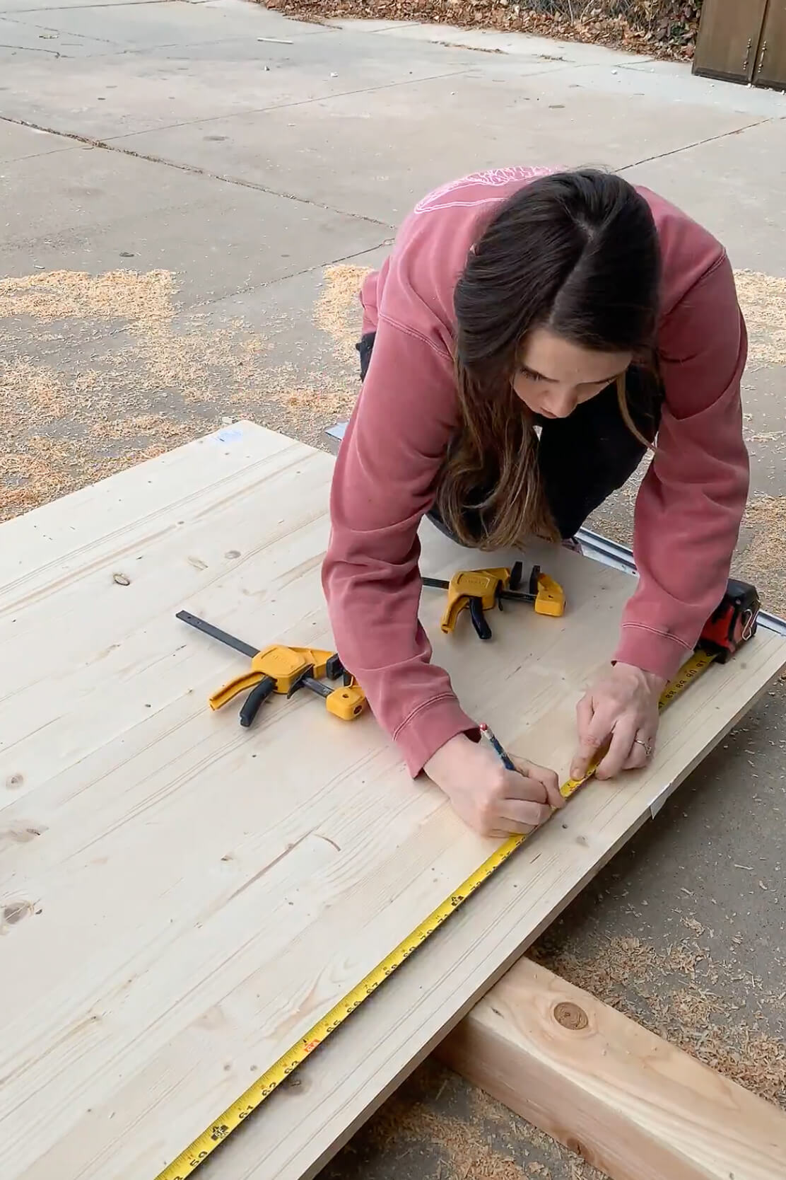 Using a circular saw to cut off the end of a DIY table.